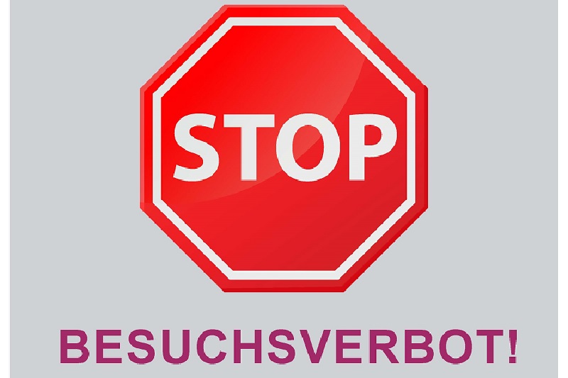 Illustration eines Stoppschildes mit der Unterschrift "Besuchsverbot!"